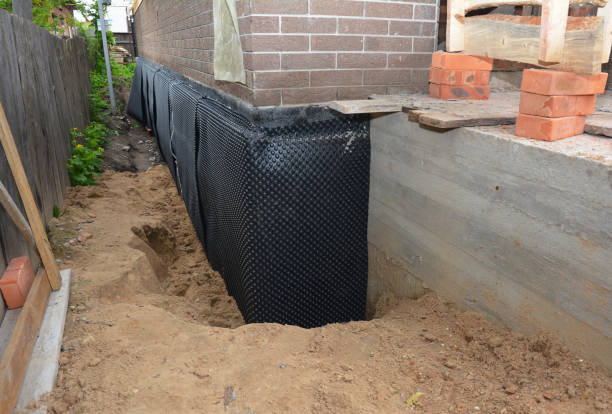 Happy homeowners after waterproofing job in Sears